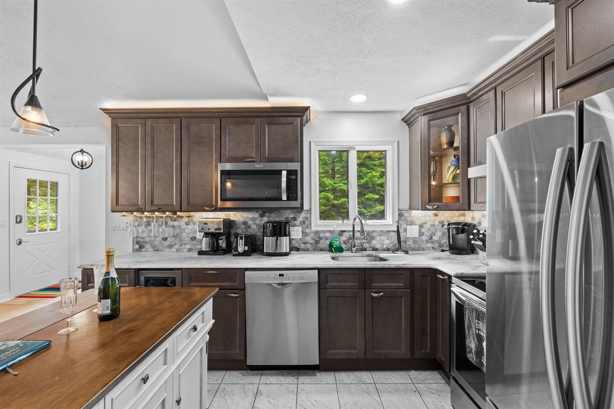 Cook with ease in this modern kitchen—includes full appliances and island counter