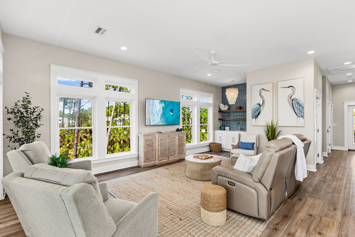 Designed for bringing everyone together, the open-concept living area offers comfortable seating, Gulf views, and plenty of room to relax after a day at the beach.