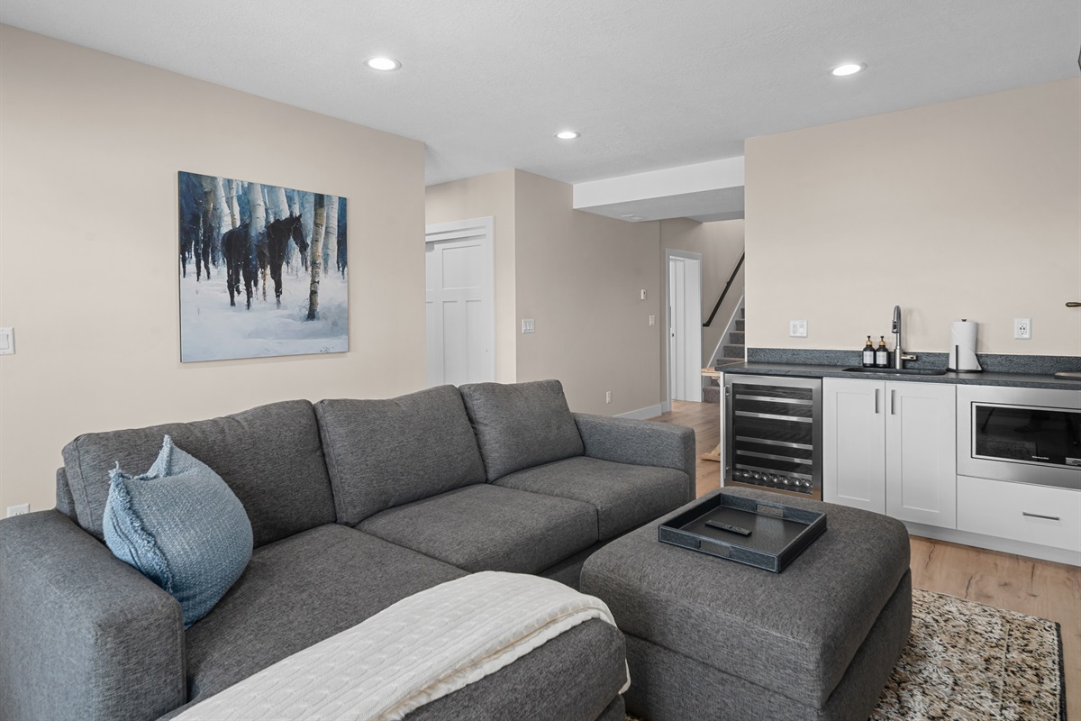 Lower-level lounge with kitchenette for added convenience.