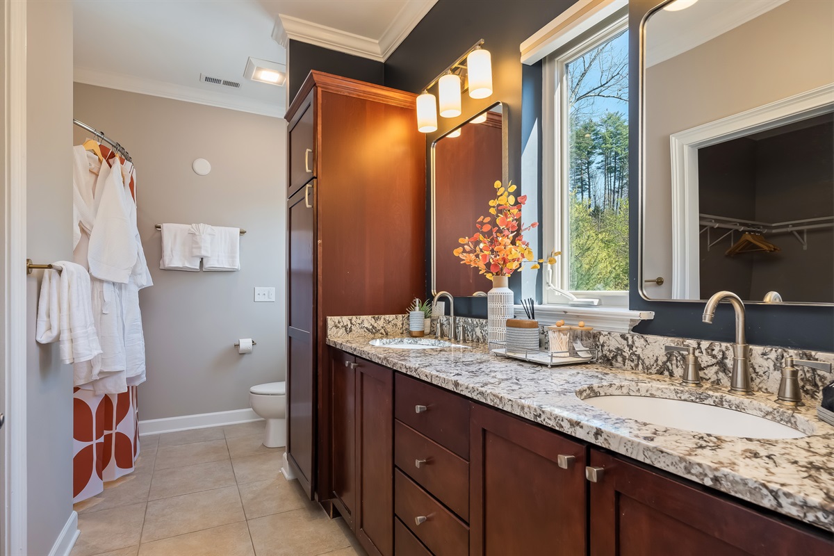Spacious bathroom with double vanity and natural light - great for getting ready as a group