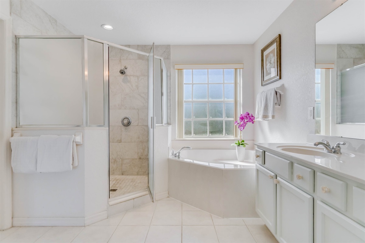The master bath features a huge garden tub and a walk-in shower.