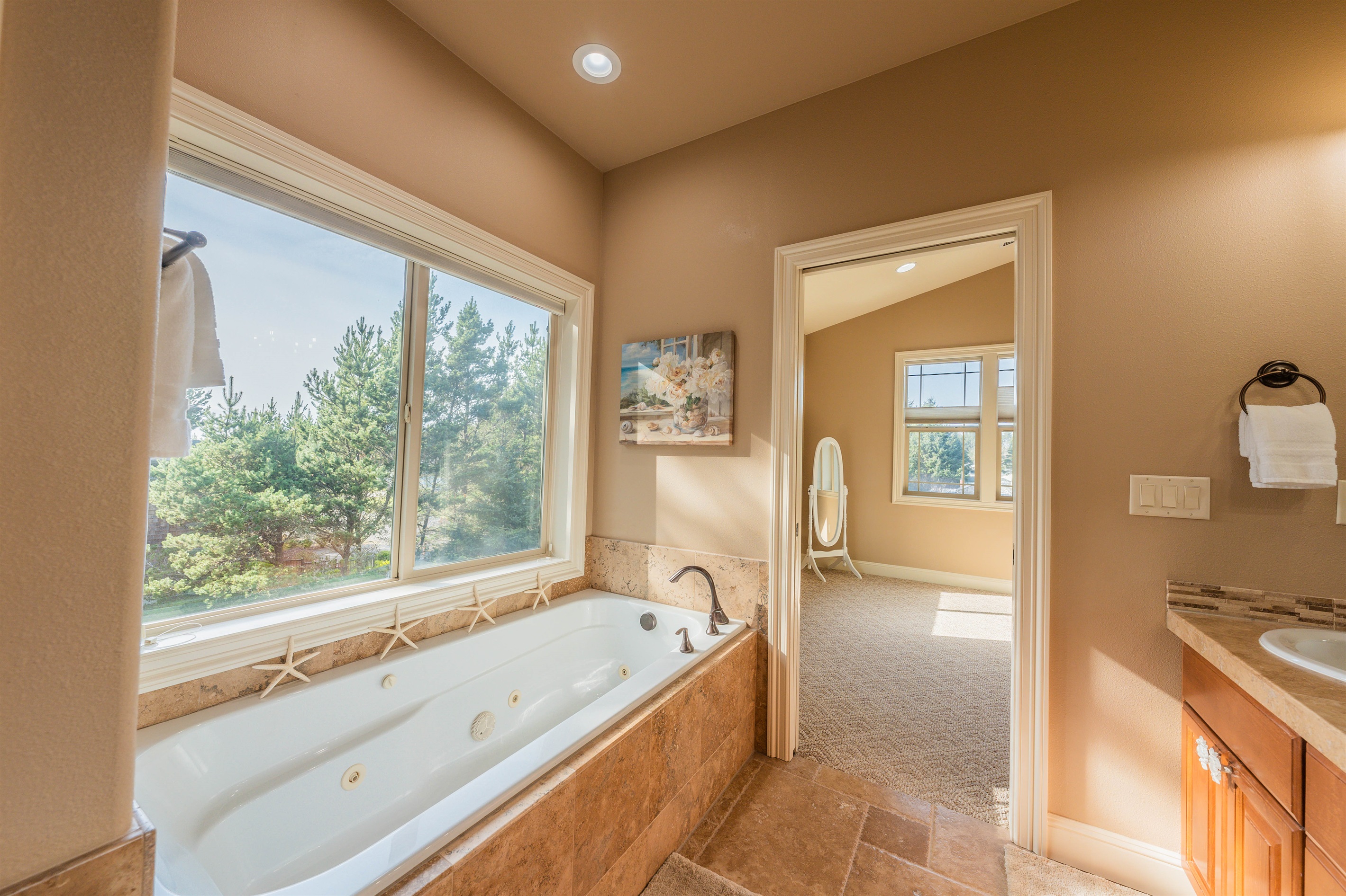 Primary ensuite with jetted soaking tub.