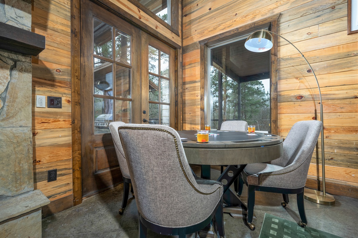 Poker time: Gather around a stylish table with wooded views and chill vibes! Perfect for meals and games!