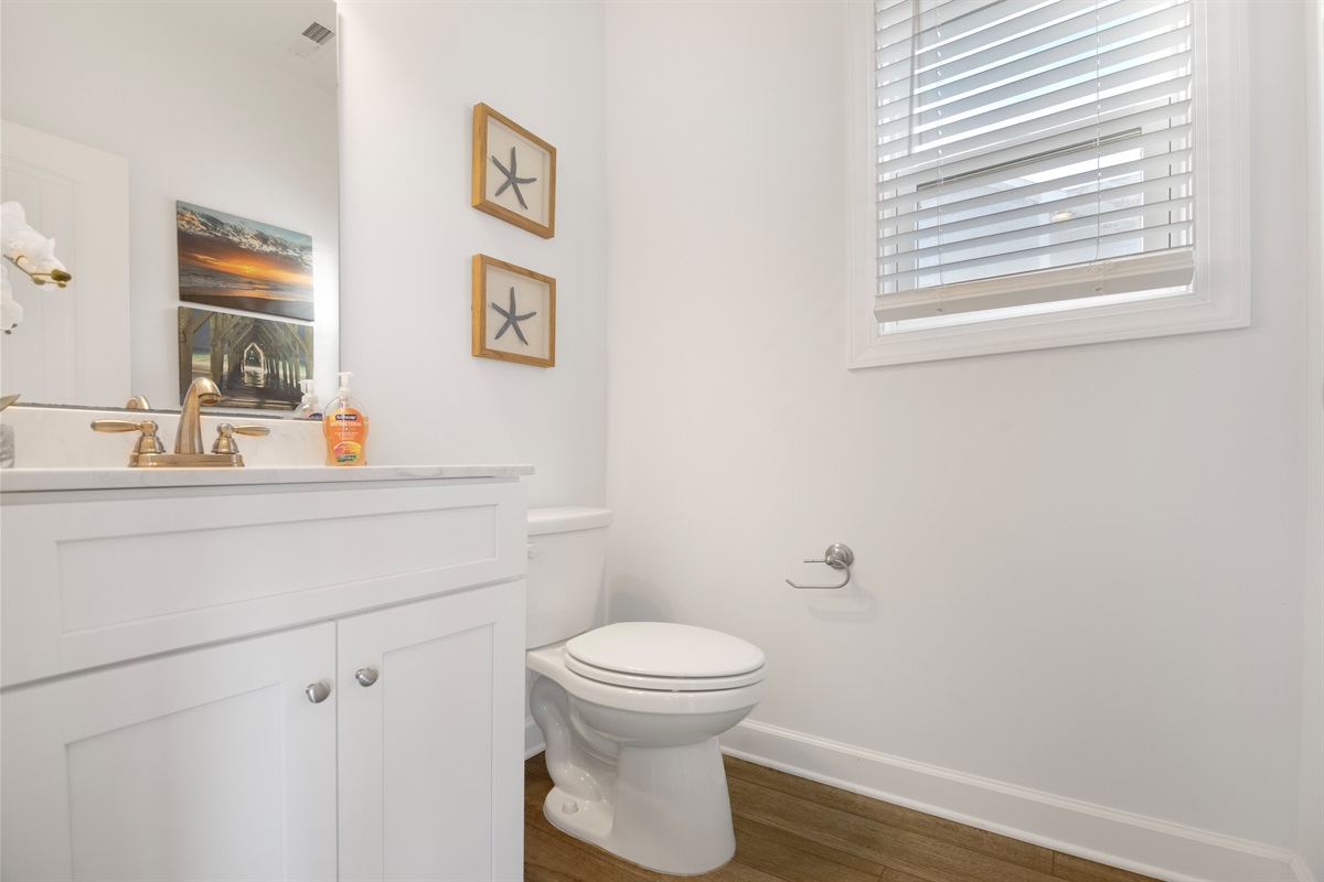 A convenient hall bath located off of the kitchen