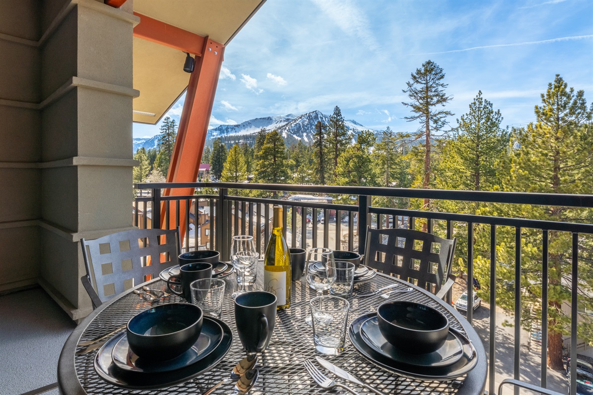 Three balconies create space to spread out -- this large balcony off the living space offers al fresco dining, drinks, and endless mountain views.