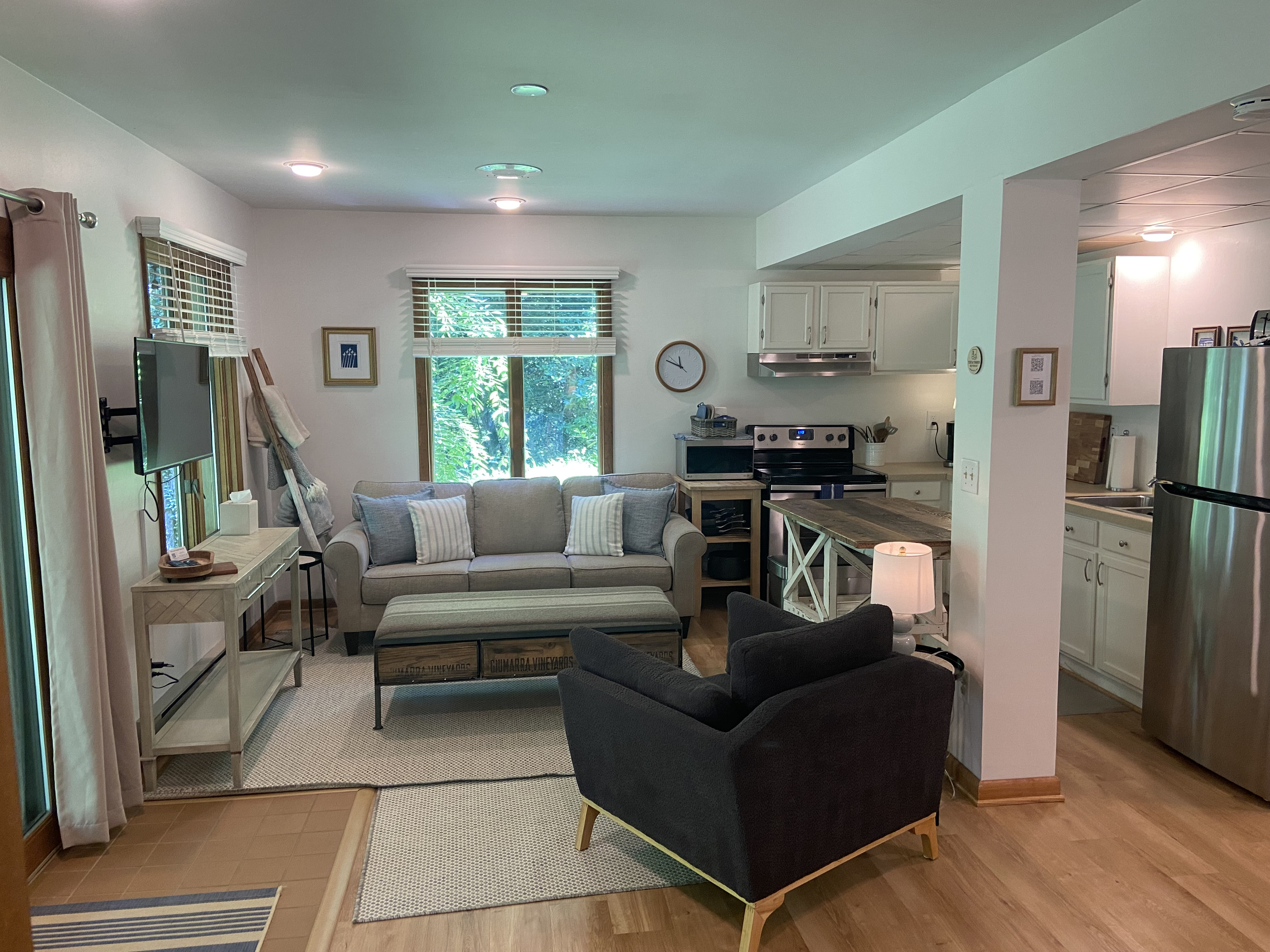 The living room offers a cozy space to spread out and relax.