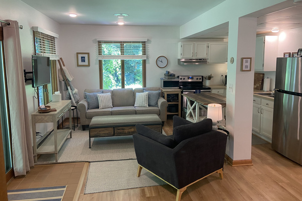The living room offers a cozy space to spread out and relax.