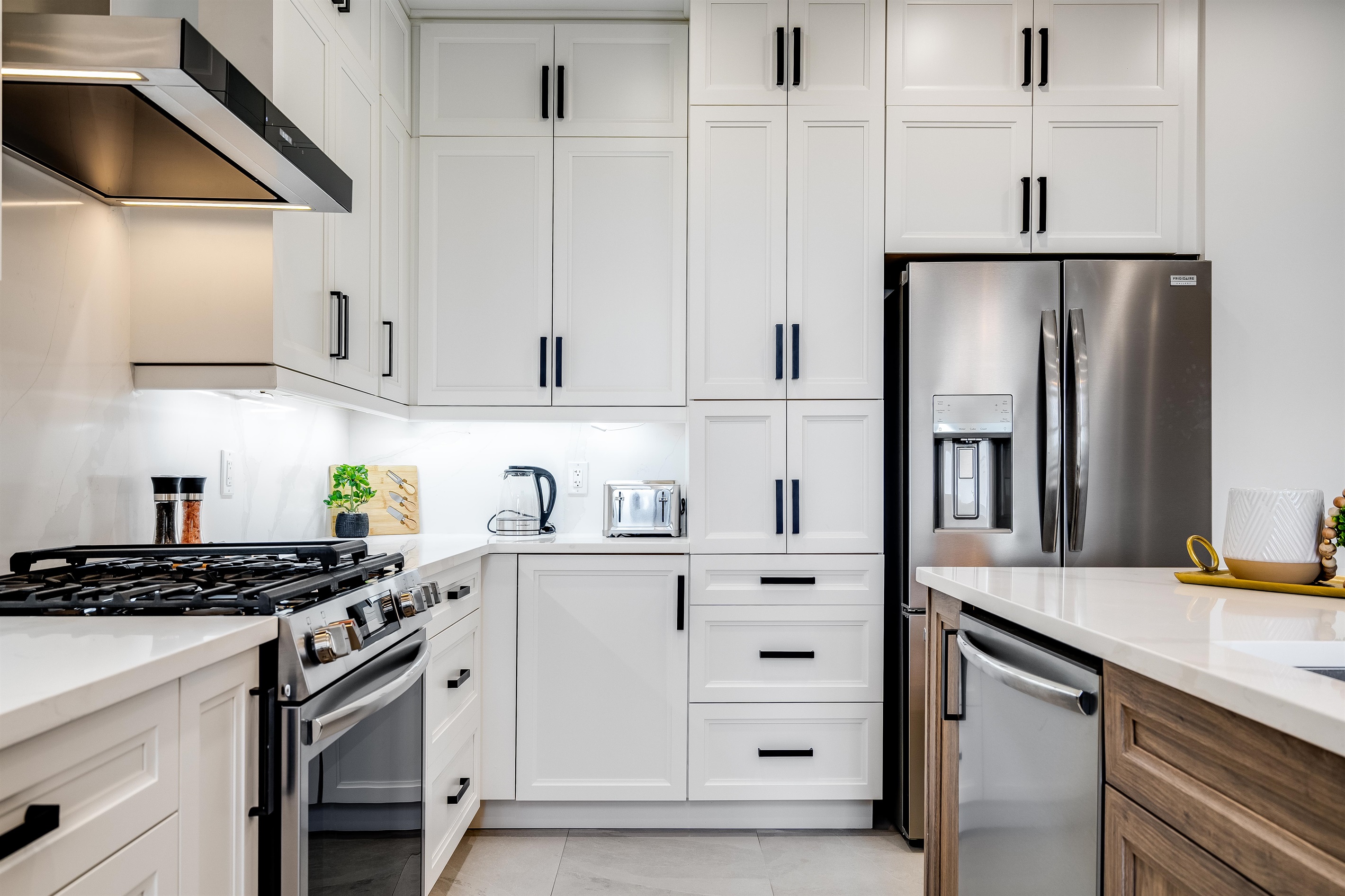 Polished countertops gleam in modern lighting.