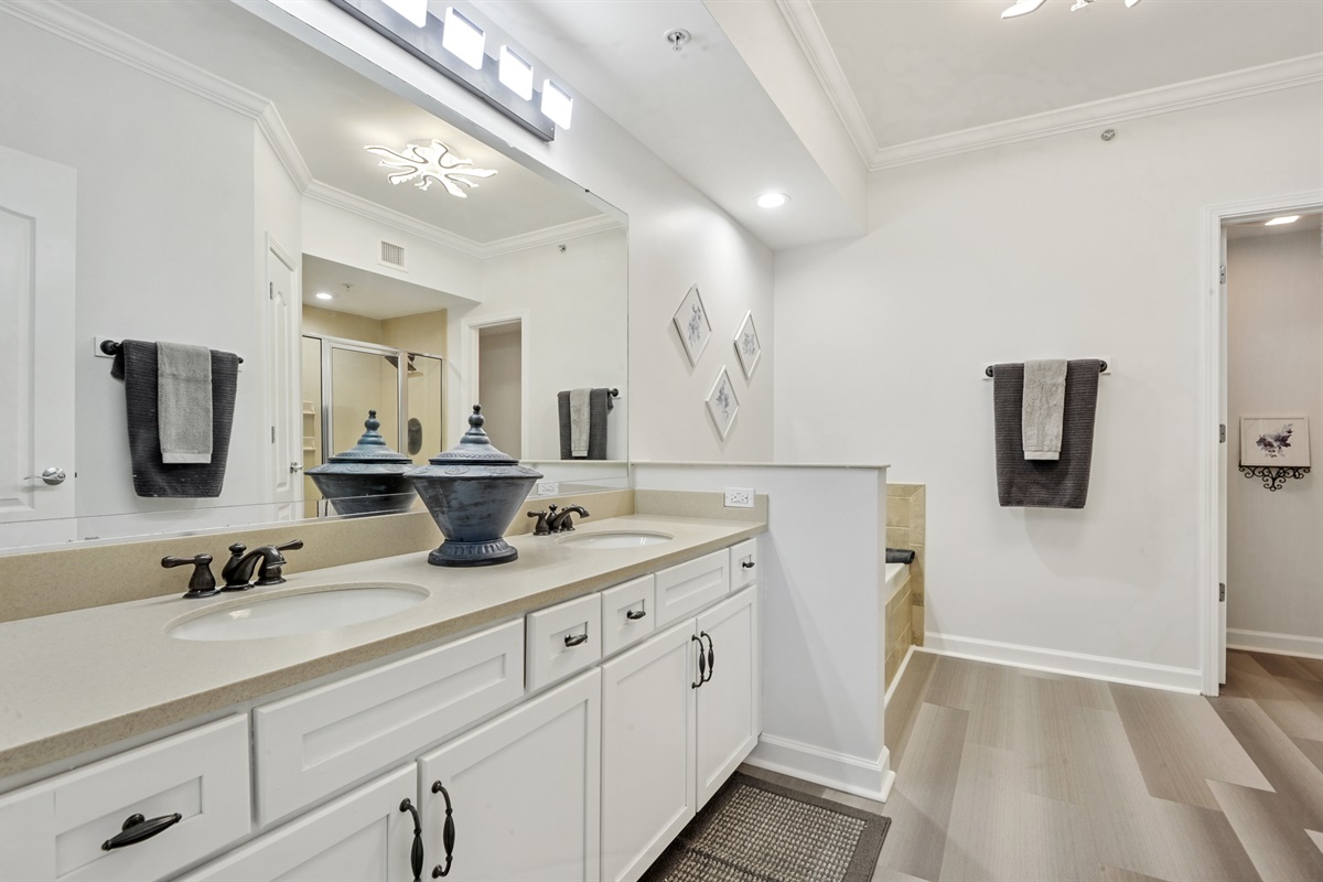 Master bath with jacuzzi, dual vanity, shower, toilet closet