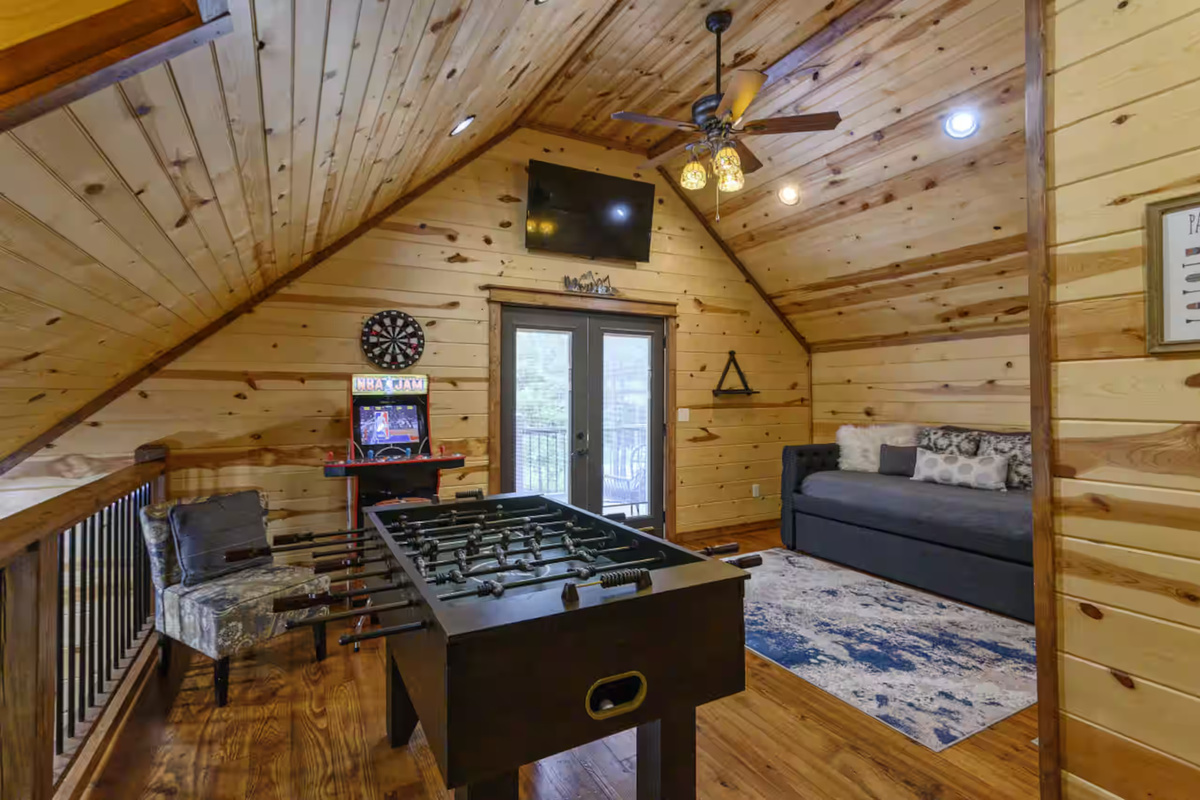 Game Room: Unwind with foosball and retro arcade fun in this stunning wooden retreat!