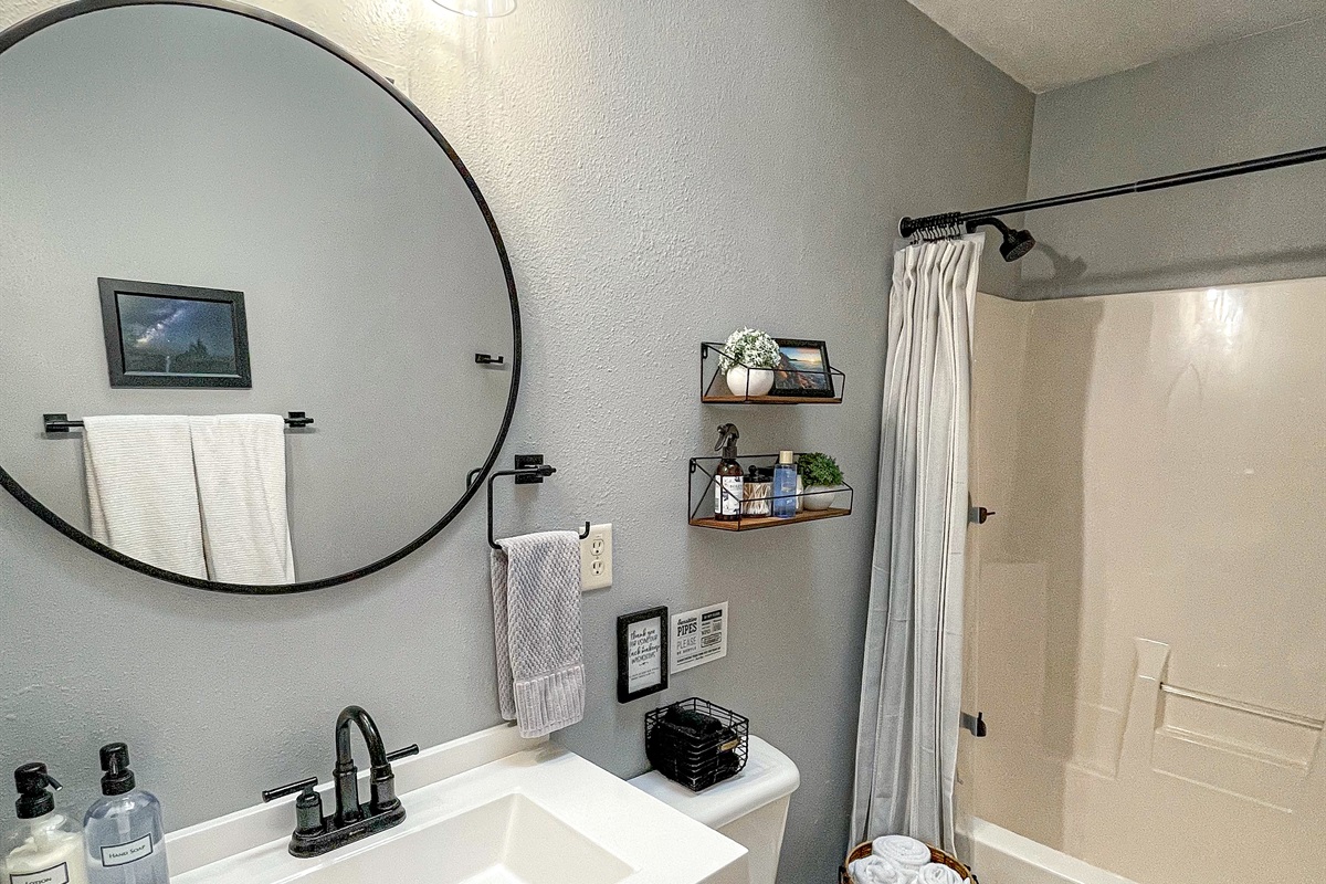 Bathroom with vaulted ceilings and skylight.  Heat fan for warmth. Enjoy complimentary toiletries shampoo conditioner body wash Q-tips, makeup remover and pads, cotton balls, lotion. 