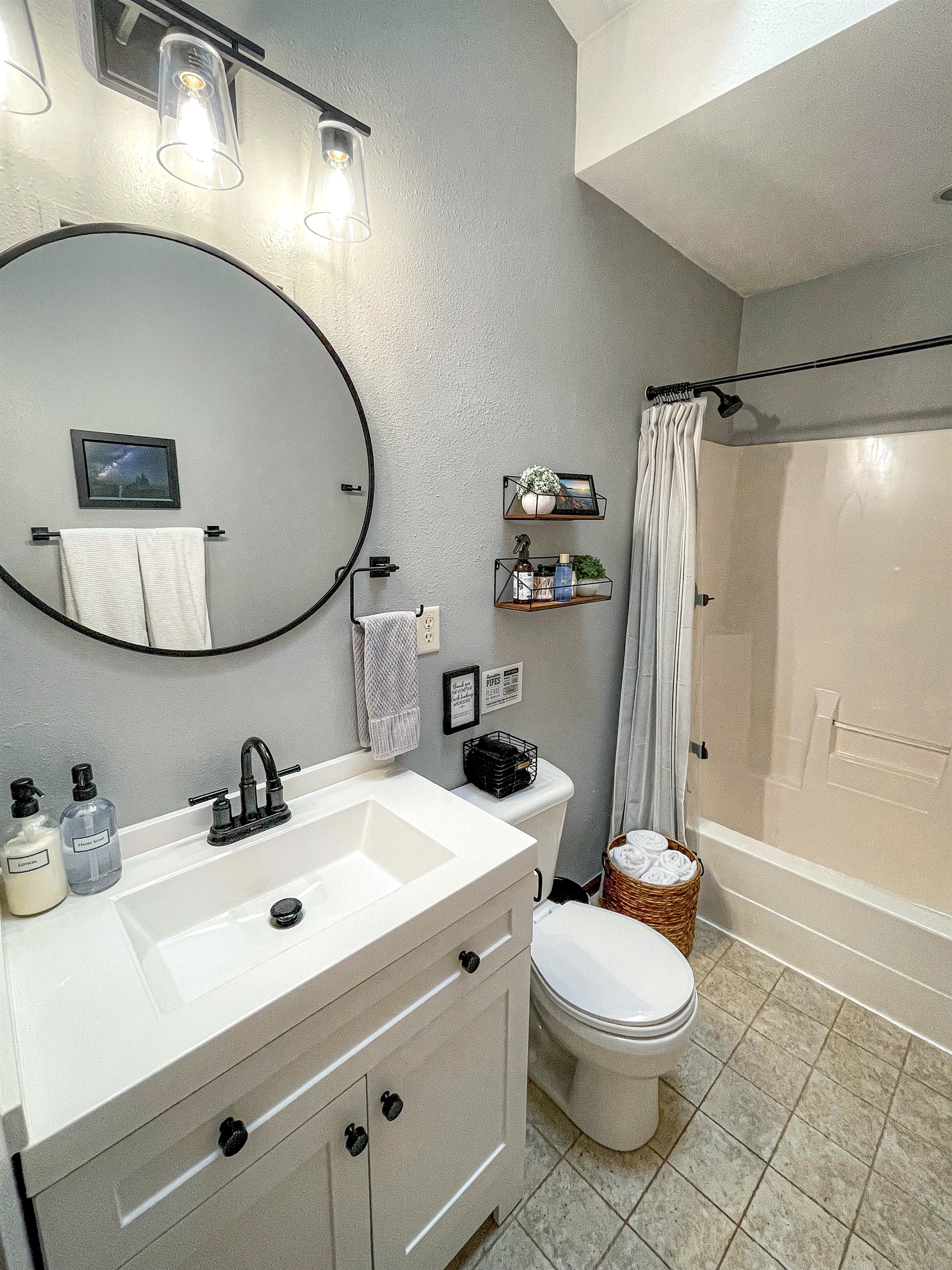Bathroom with vaulted ceilings and skylight.  Heat fan for warmth. Enjoy complimentary toiletries shampoo conditioner body wash Q-tips, makeup remover and pads, cotton balls, lotion. 