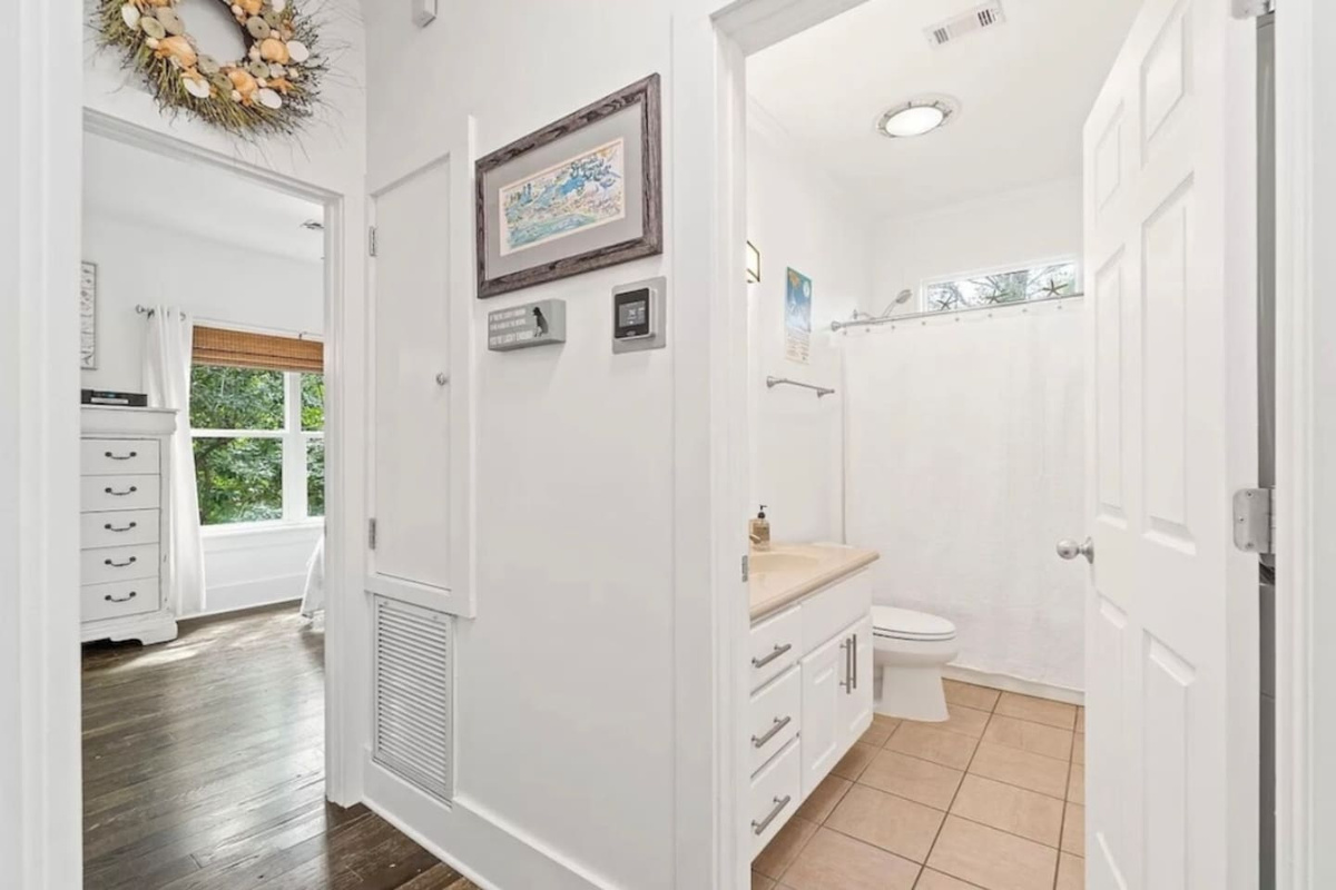 Hall bathroom has a bath/shower & washer dryer