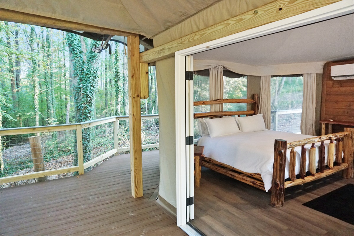 Rustic Retreat: Experience nature through airy windows and natural wood decor in this enchanting getaway!