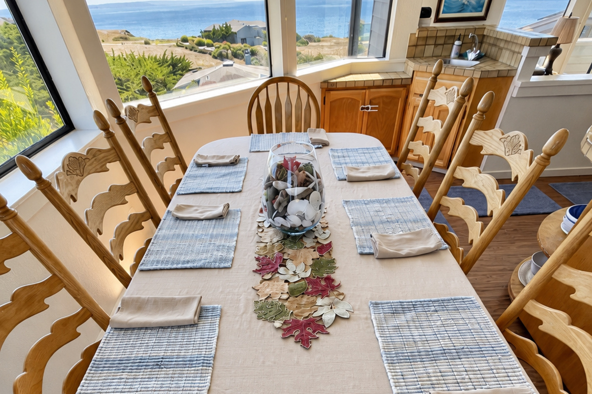 Dining Table seats 8-10. Dining area off Kitchen faces Ocean views to South and 8th Fairway to East.