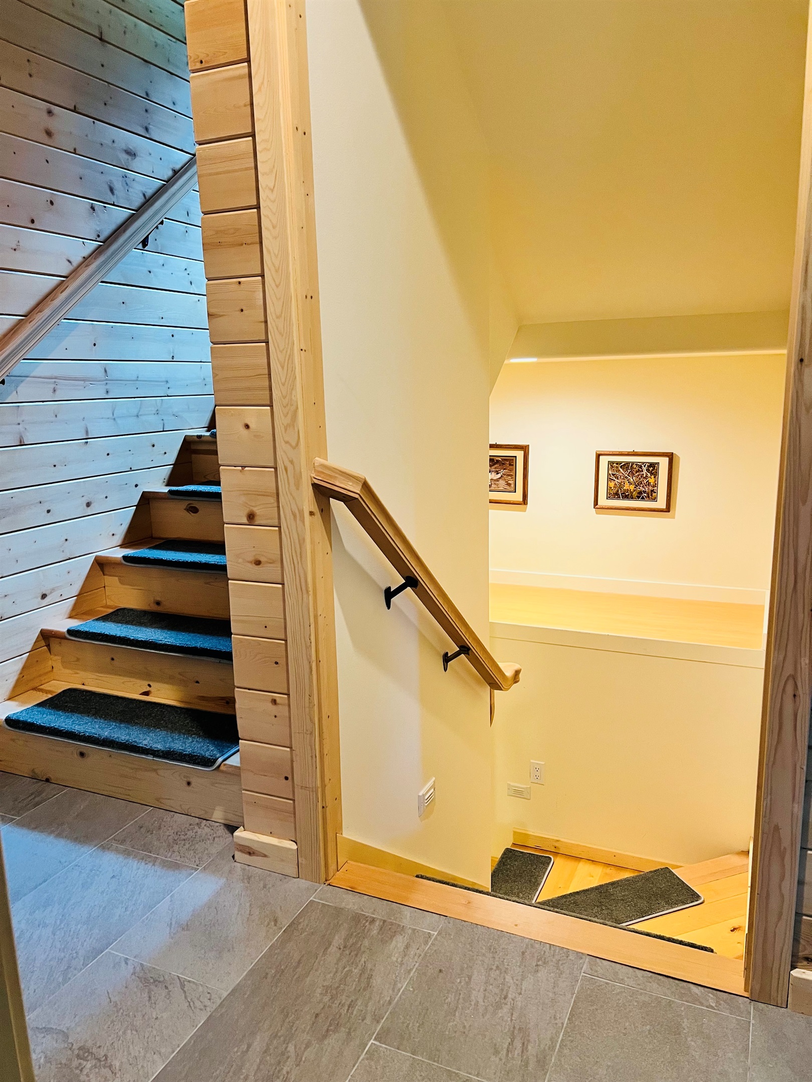 This home has three levels allowing guests to have their own private areas of the home. Stairs on primary level lead both upstairs and downstairs to lower basement level.