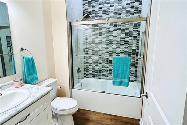 Modern Full Bath: Experience a stylish retreat with elegant tile and sleek fixtures!