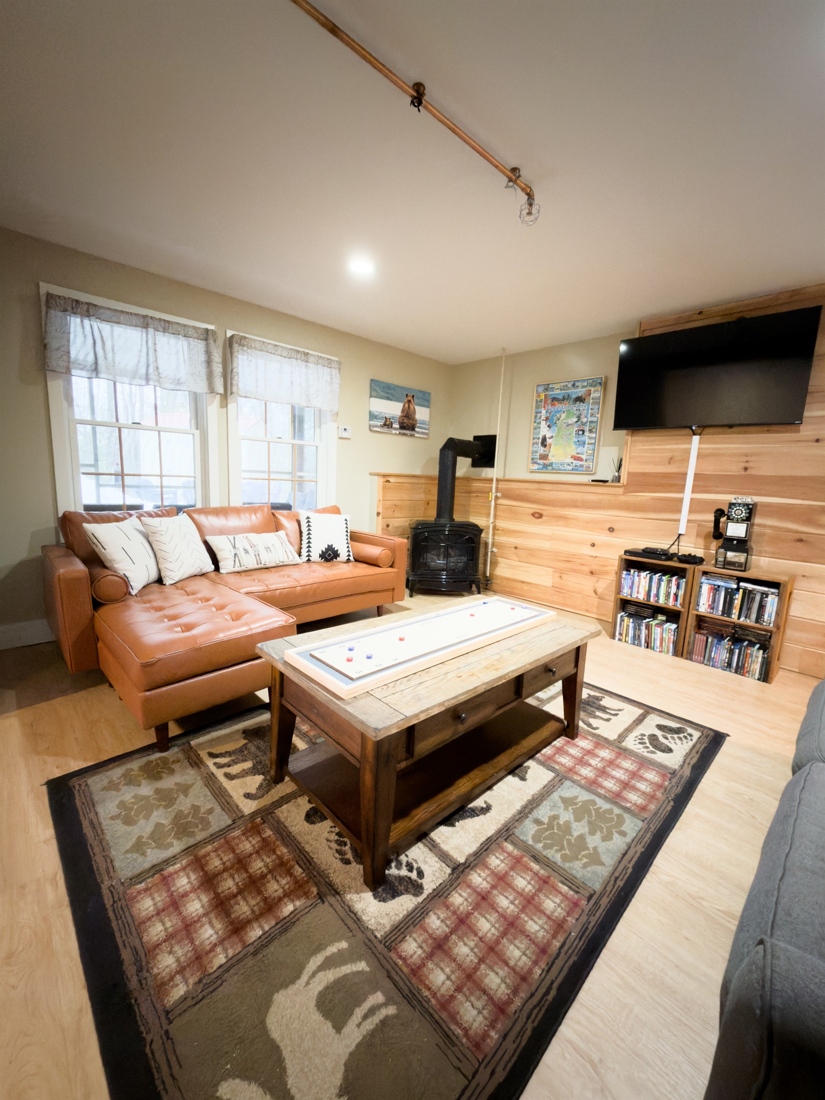 Living Room - Lower Level. Ultimate hangout spot, warm up by the gas fireplace, sink into the couch or game night. 