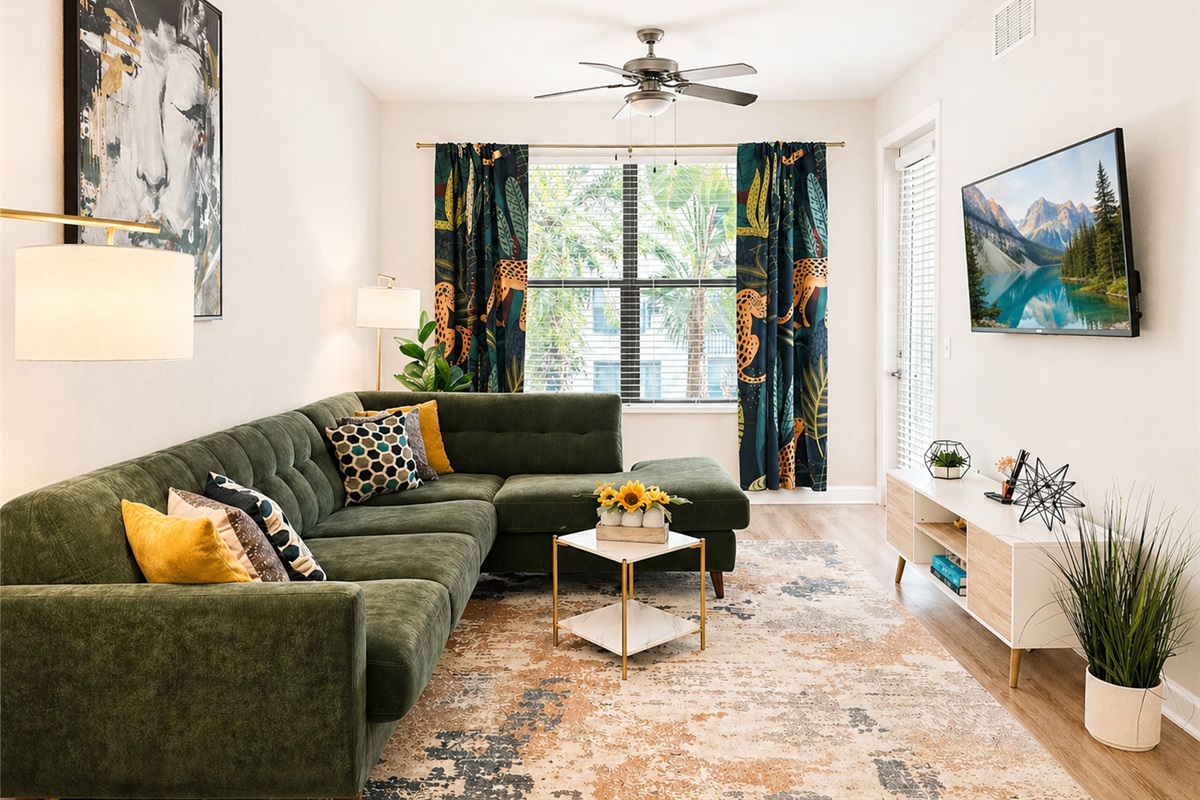 The well-designed living room overlooks a courtyard filled with tropical foliage and the sounds of doves cooing. The sectional turns into a queen sleeper sofa. Linens provided.