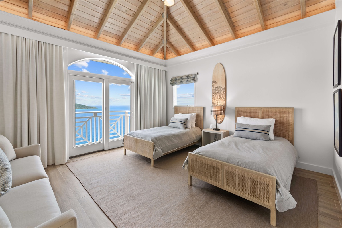 Bright and breezy with two twin beds, AC, and high ceilings. The perfect blend of comfort and charm.