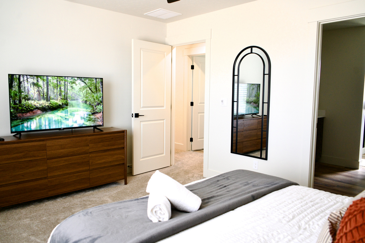 Open-concept view of the primary bedroom, offering a bright, airy feel with a spacious, inviting layout.