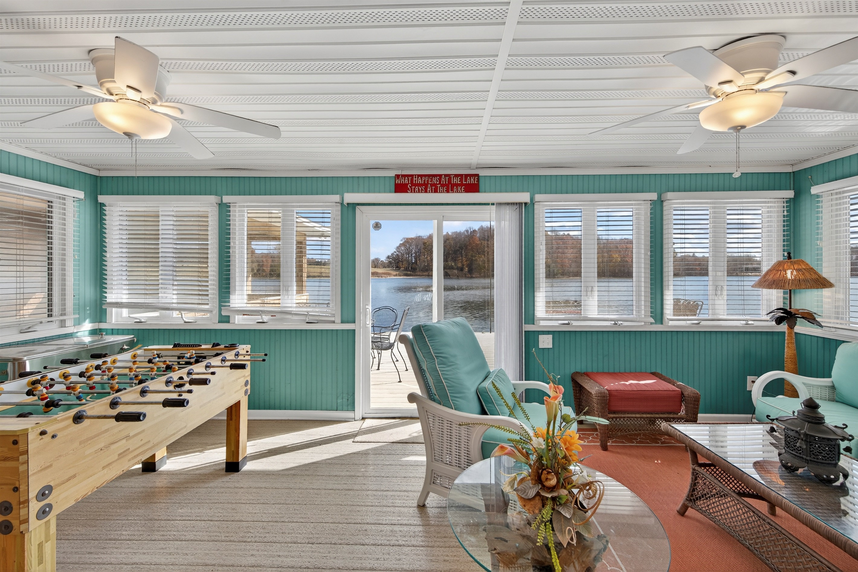 Lakeside entertainment area offering games and seating just off the dock.