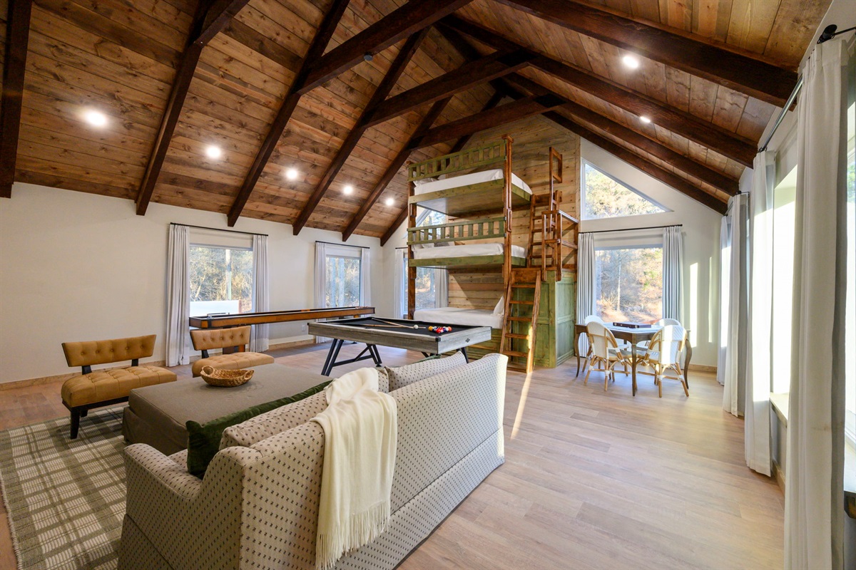 Spacious game loft with pool table + shuffle board + additional lounge space.