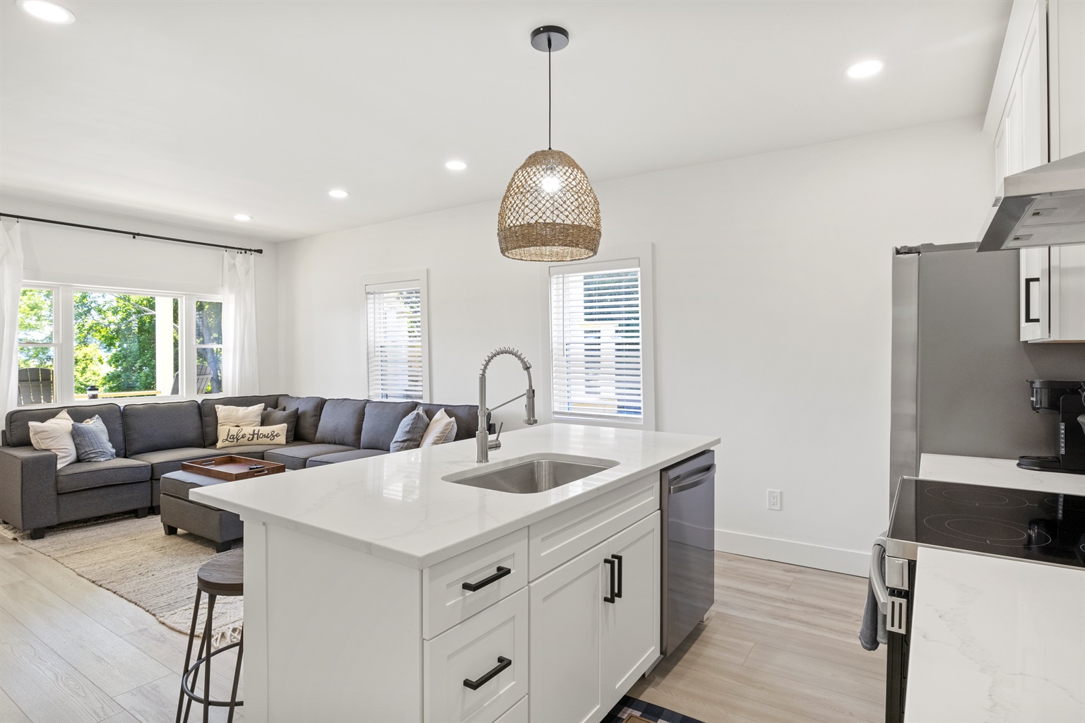 Kitchen has fridge with ice maker, microwave and Keurig with coffee supplies. 