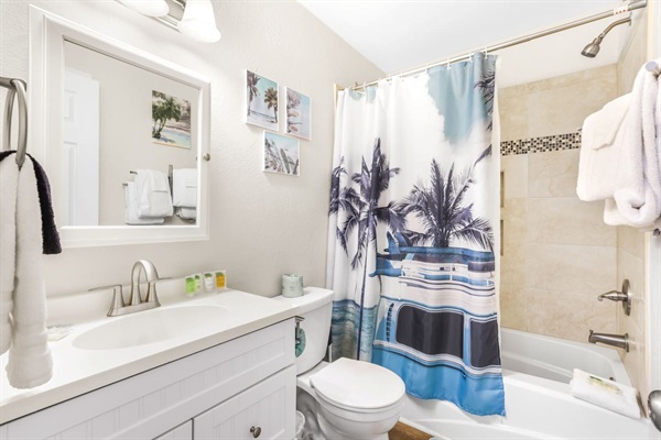 Hall bathroom with tub shower combo.