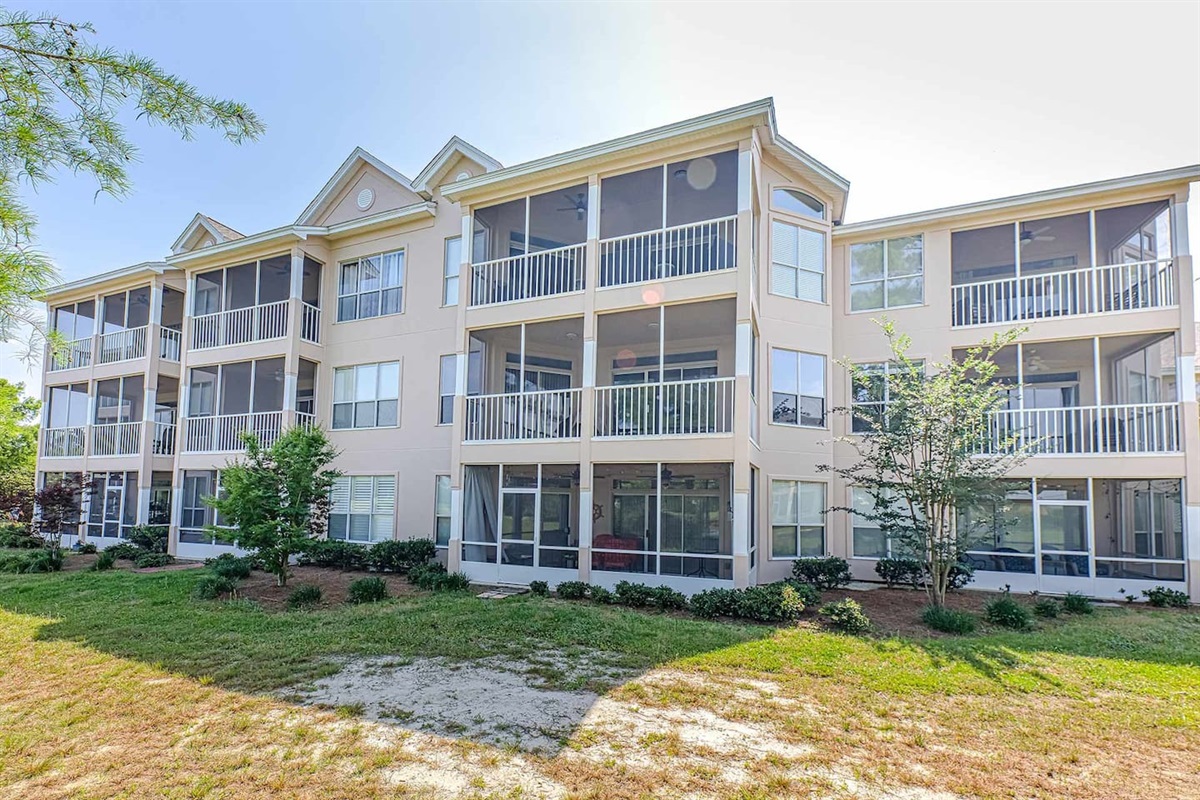 Exterior Oasis: Inviting balconies and lush greenery await your perfect Gulf Shores retreat!