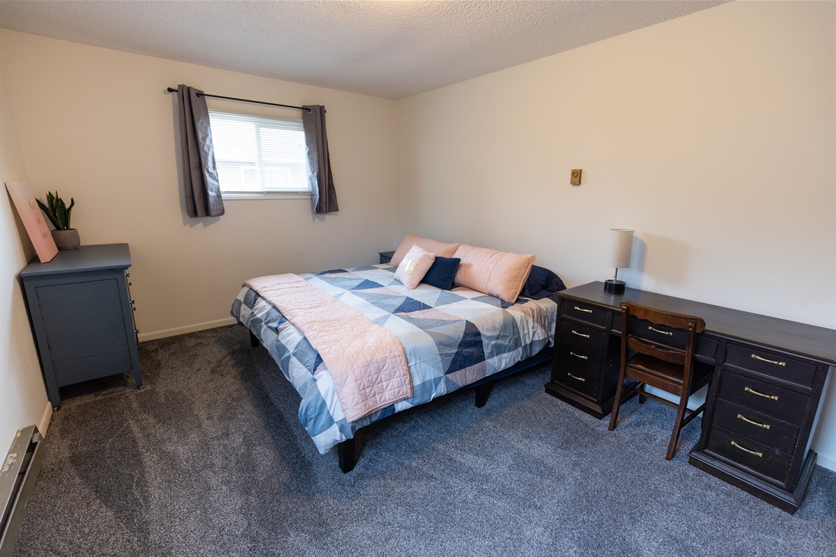 Back bedroom with a king and dedicated work space.