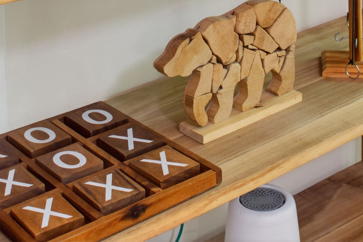 Decorative Nook: Unique bear art and games create a playful retreat in the heart of nature.