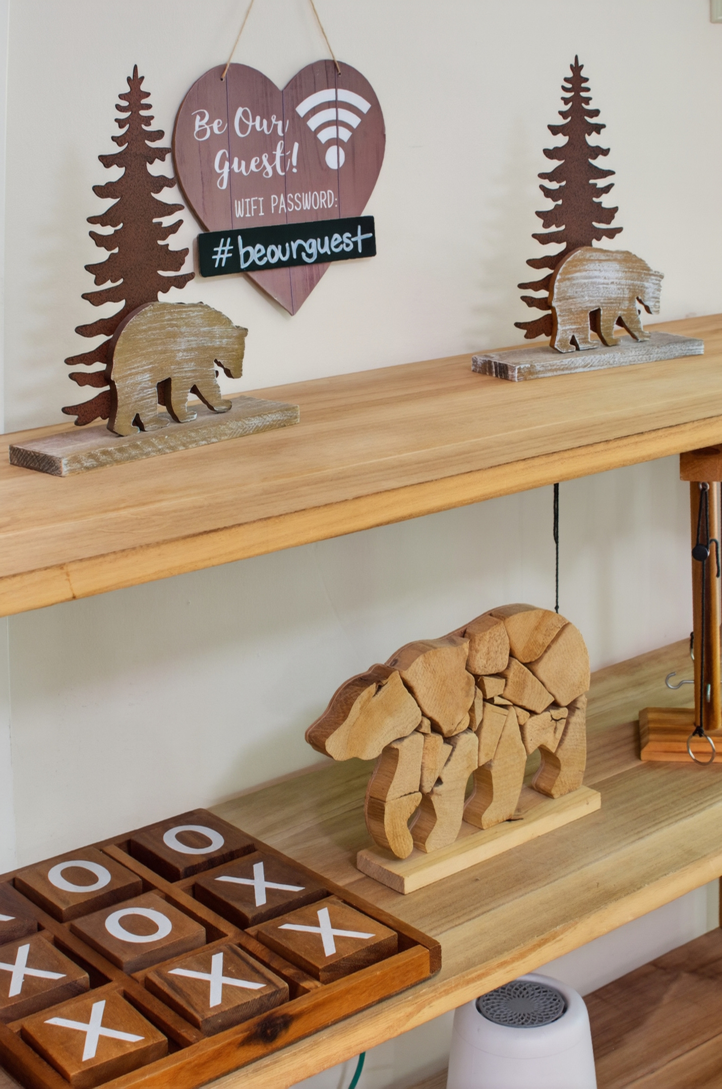 Decorative Nook: Unique bear art and games create a playful retreat in the heart of nature.