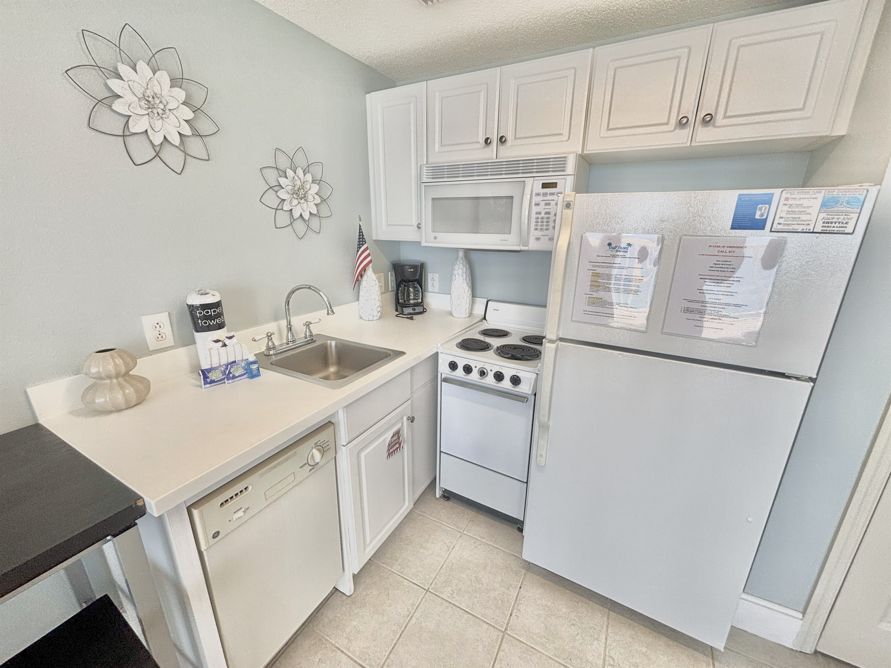 Kitchen equipped with a microwave, stove, fridge, and dishwasher!