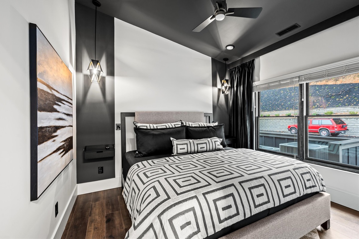 Rest easy in a spacious King-sized bed, outfitted with high-end bedding and plush pillows designed for maximum relaxation