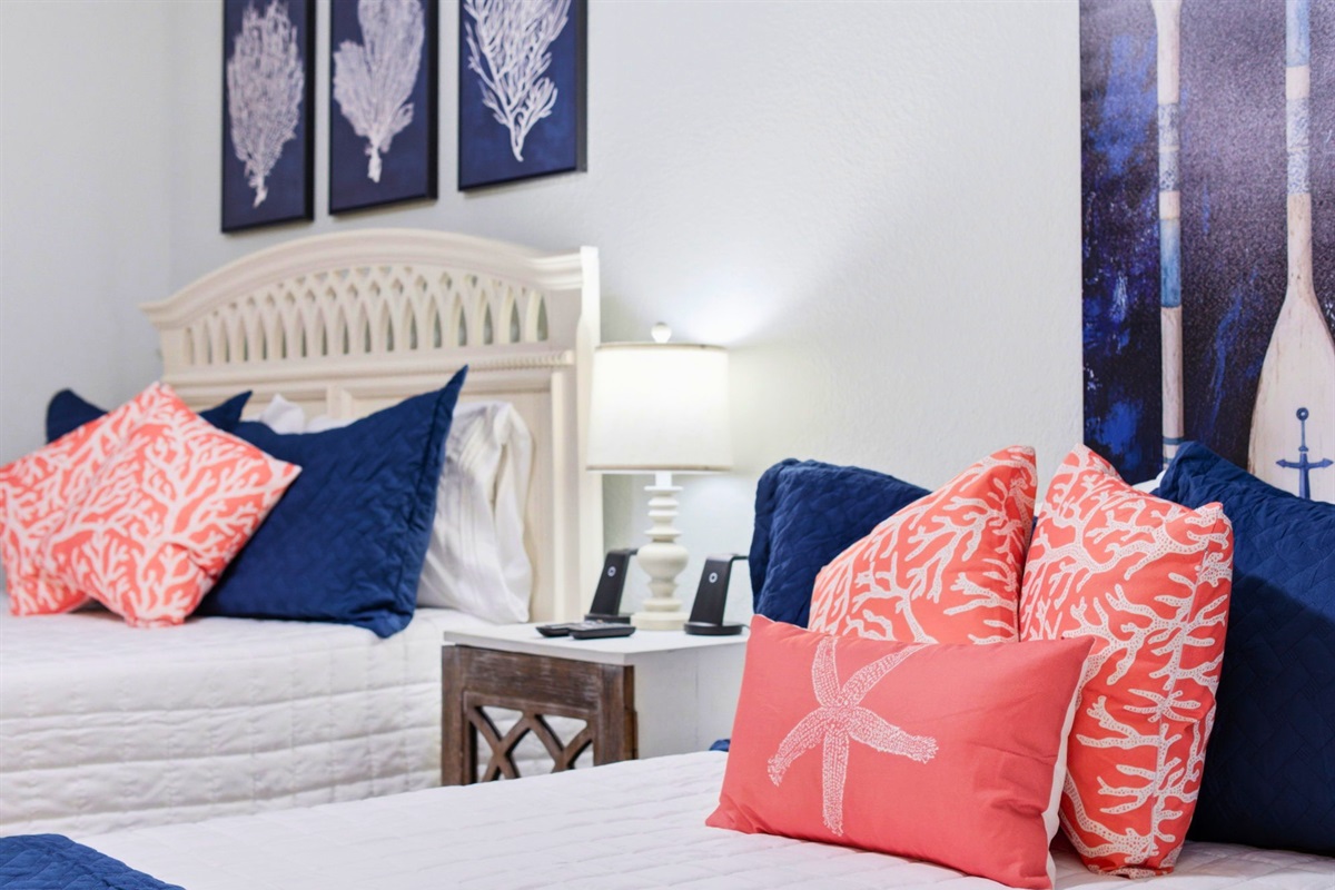 Beachy colors and charming accents help create a fun and relaxing atmosphere throughout the room.