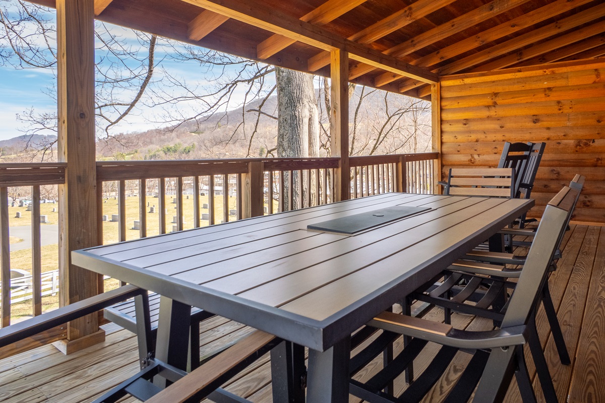 Enjoy al fresco dining with a view! The back deck offers a spacious outdoor dining area.