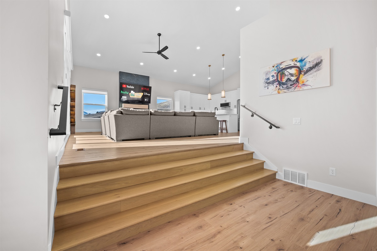 Light-filled stairway leading to the main living and gathering space.