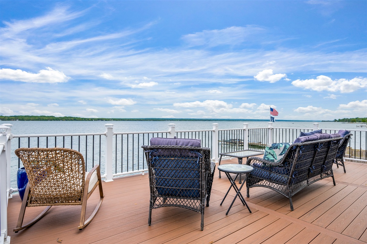 Enjoy morning coffee or sunset cocktails from the elevated deck with stunning lakefront views.