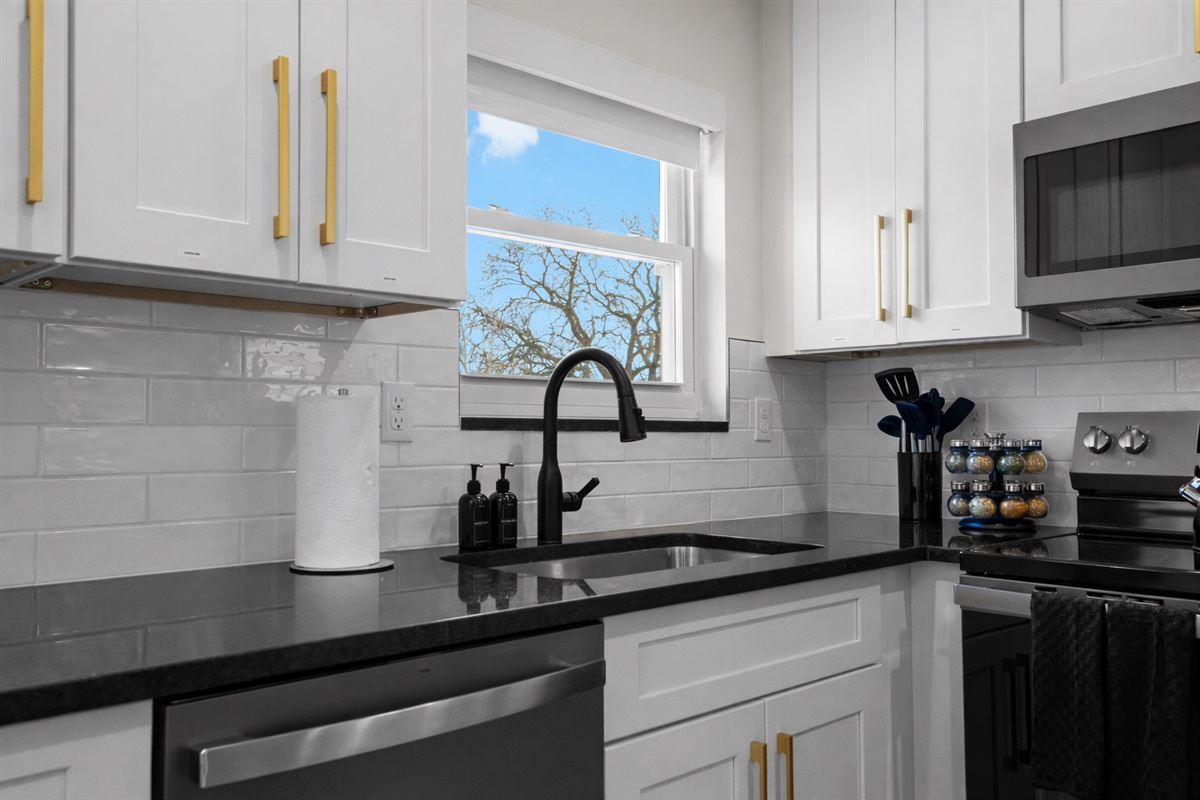 Bright, modern kitchen with sleek countertops, stylish cabinetry, and natural light—perfect for easy meal prep and everyday cooking.