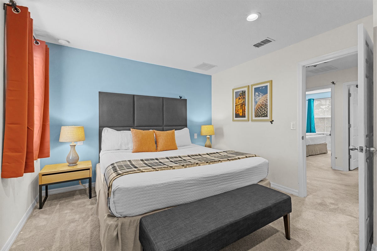 Primary bedroom with king bed and ensuite bathroom