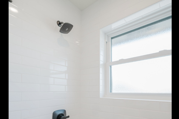 Enjoy a hot shower with excellent lighting through the frosted window.
