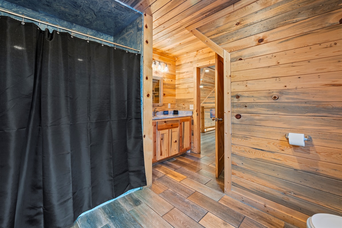 From this angle, the bathroom layout is easy to navigate and includes a spacious walk-in shower.
