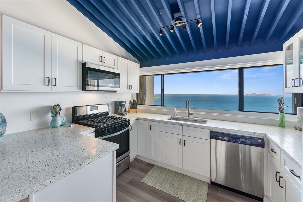 A fully equipped kitchen with, modern appliances, and dreamy views; cooking just got an upgrade.