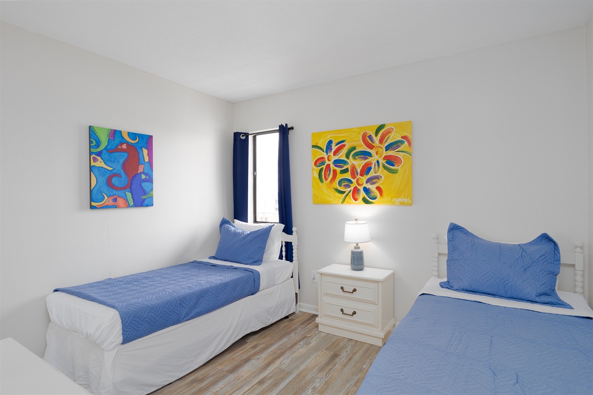 Colorful artwork livens up the kids' bedroom
