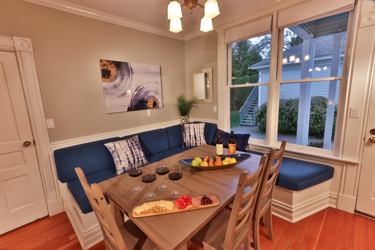 Enjoy casual mornings or afternoon hangouts in the charming breakfast nook, adjacent to the kitchen and wood stove (firewood provided)