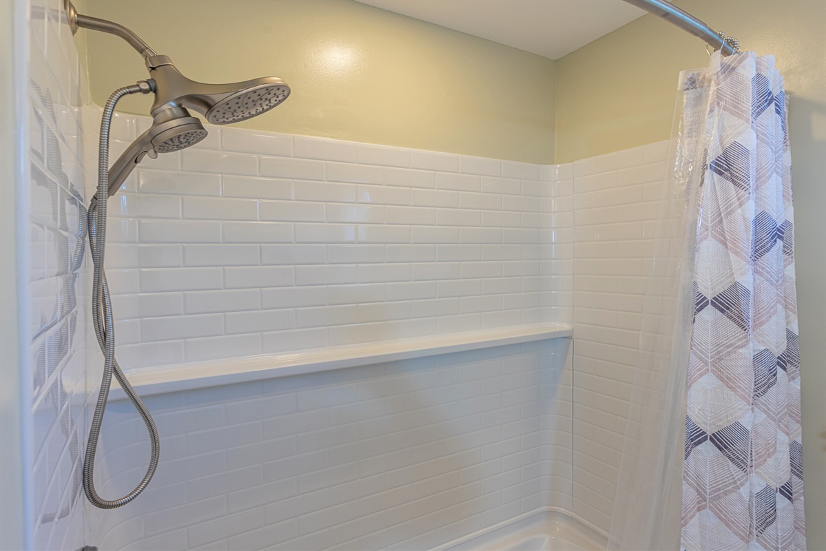 Dual Head Shower with Tiled Surround and Tub