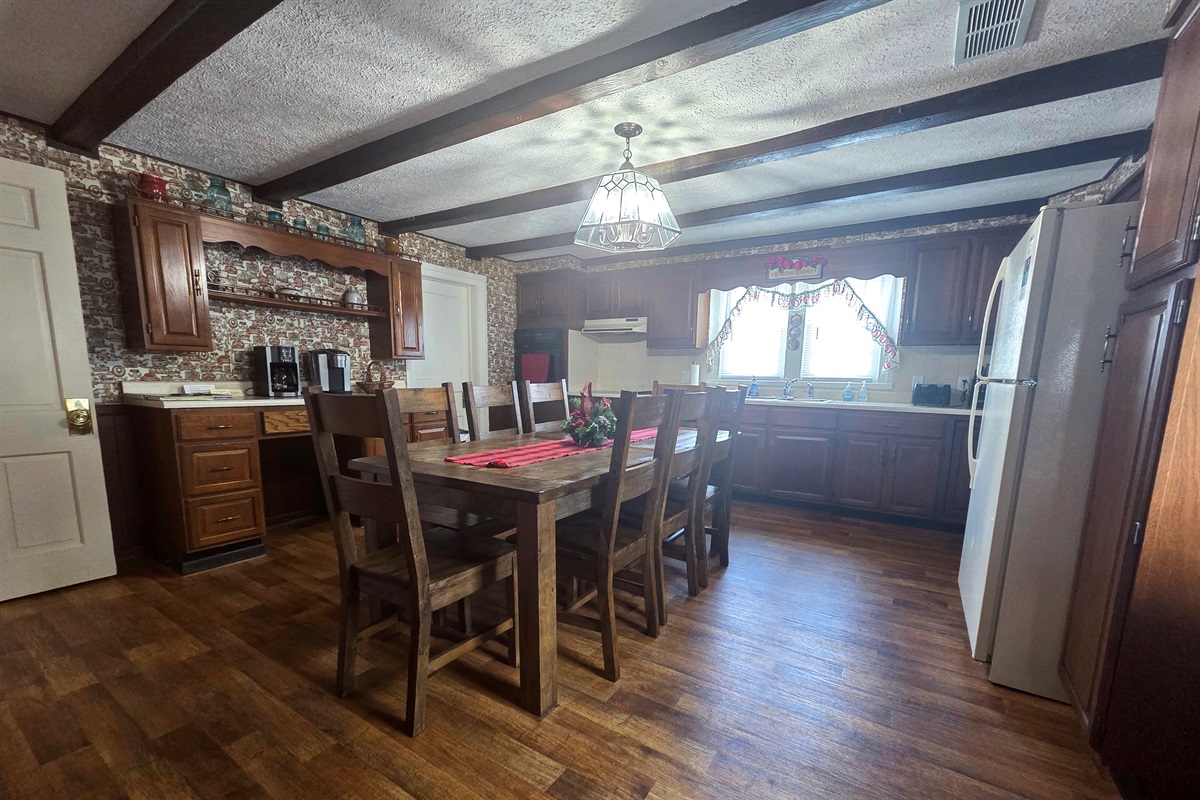 The farmhouse kitchen is warm and inviting, with plenty of room for gatherings, meal prep, and making memories