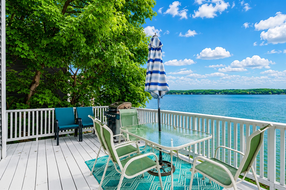 Expansive lakefront deck with stunning views, perfect for morning coffee