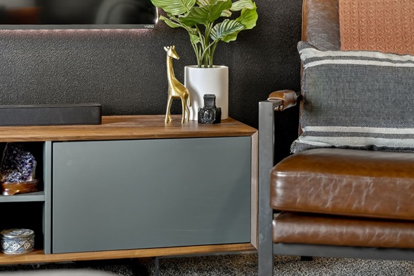Minimalist design with art, plant décor, and stylish accents.